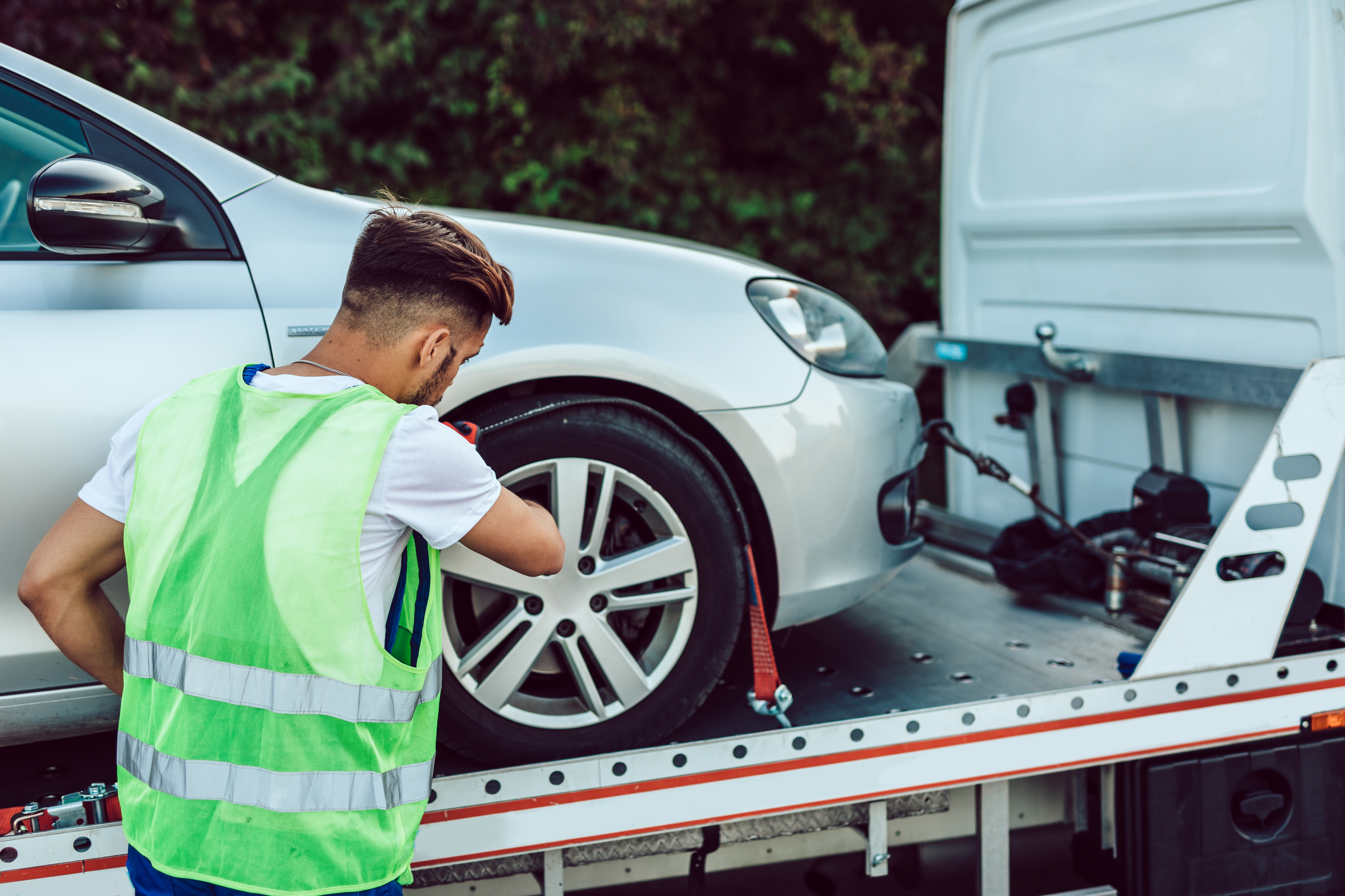 handsome-middle-age-man-working-towing-service-road-roadside-assistance-concept